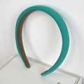 Teal padded sponge headband with non-slip velvet lining on a white background - Green