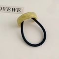 Elegant acetate bow hair tie in yellow marble finish with black elastic band - Green Semicircle Style