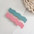 Set of two matte wavy hairpins in pastel pink and teal blue on a minimal background - Blue Red Style