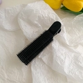Black hair root volumizing clip with velcro surface for styling on white background - Black-B