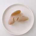 Champagne acetate claw clip with irregular wavy edges in a minimalist ceramic dish - Champagne Marble