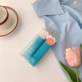 Set of two blue and white hair root lifting clips in clear box with lifestyle props - Blue-Style A