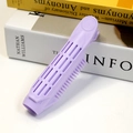 Light purple hair root volumizing clip with hollow vents and fine comb teeth on a desk - Light Purple-Style C725