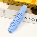 Light blue root lifting clip with air vents placed on a book for hair styling - Light Blue-Style C725
