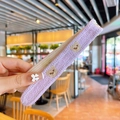 Knitted purple hairband with cartoon bear embroidery for girls, soft texture view - Purple Bear