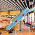 Blue knitted hair clip for girls featuring cute strawberry embroidery and soft texture - Blue Strawberry