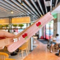 Pink knitted hairband for girls featuring red cherry embroidery and soft texture - Pink Cherry