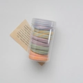 Elastic seamless towel hair ties in colorful striped patterns stored in a clear plastic jar - Striped Morandi Colors