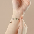 Elegante pulsera de plata de ley con lirio de los valles y cuentas de jade verde para mujer - Estilo Virutas de Plata Mariposa Lirio de los Valles