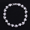 Elegant bridal jewelry set with white pearls and sparkling rhinestones on silver base - Bracelet