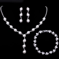 Elegant bridal pearl and rhinestone jewelry set including necklace earrings and bracelet - Necklace Earrings Bracelet