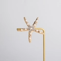 Dettaglio del fermaglio per capelli a stella marina con perle e lega color oro champagne - Oro