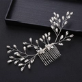 Detailed shot of silver bridal hair comb with marquise rhinestones in leaf design - Silver