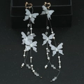 Elegant long fringe butterfly clip-on earrings with gold finish and grey tulle wings - Butterfly Tassel Earrings