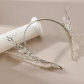 Elegant silver bridal headband with crystal feather design on a white column base - Silver