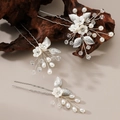 Three-piece bridal hair pin set with white ceramic flowers, metal leaves and pearls - Silver