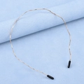 Minimalist golden wavy metal headband with protective black tips on a blue background - Gold