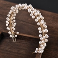 Detailed macro shot of bridal hair accessory with white pearls and gold wire vine - Gold Pearl Version