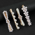 Set di 4 eleganti fermagli per capelli con perle e base dorata su sfondo nero - Molteplici stili di combinazione / Oro