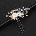 Handmade bridal hair pin featuring white ceramic flowers, gold leaves and pearls on black leather - Gold
