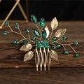 Golden bridal hair comb featuring emerald crystals and vintage leaf filigree - Green