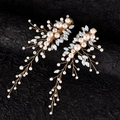 Detail of handmade bridal hair clips with white pearls and blue marquise crystals - Gold
