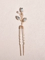 Close-up of gold U-shaped bridal hair pin featuring marquise rhinestones and white pearls - Gold
