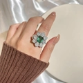 Elegant emerald-cut green gemstone ring with diamond flower petals on silk background - Adjustable Open / Silver (Flower Open Ring)