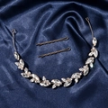 Detail of rose gold bridal headband and hairpins with zircon leaves on blue silk - Rose Gold Style 2