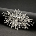 Elegant silver bridal hair comb with sparking crystals and rhinestone leaves on black background - Silver