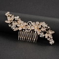 Elegant gold bridal hair comb featuring rhinestone flowers and symmetrical leaf designs - Hair Comb / Gold
