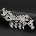 Elegant silver bridal hair comb with crystal flowers and leaves on a premium dark base - Hair Comb / Silver