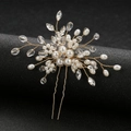 Macro detail of bridal hair pin with pearls and crystals on gold wire floral design - Gold