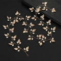 Elegant bridal gold hair vine with white pearls and leaves in a set of two pieces - Gold
