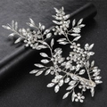 Luxury handmade bridal hair clip with silver leaves and marquise diamonds on dark background - Silver