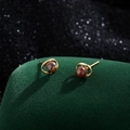 Retro tiger eye stone planet stud earrings with gold Saturn rings on green velvet - Tiger Eye Style (Gold Plated Copper)