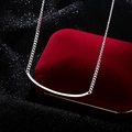 Elegant 925 sterling silver smile necklace on a luxury red velvet jewelry box - Silver