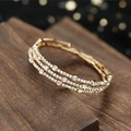 Elegante bracciale elastico dorato a tre file di strass con cristalli scintillanti da sposa - Oro