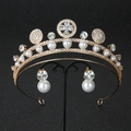 Close-up of luxury bridal tiara set with gold alloy, zircon and white pearls on black stand - Gold Tiara & Earring Set