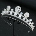 Close-up of luxury bridal crown with radiant zircons and white pearls on a black stand - Silver Tiara