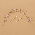 Makroaufnahme von goldenem Seestern-Haarband und Clips mit funkelnden Strasssteinen - Haarranken- und Clip-Set / KC Gold