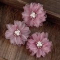 Close-up of white pleated fabric flower hair clips with pearls and rhinestones details - Purple