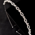 Elegante bruidshaarband van zilverlegering met infinity-knopen en glanzende strass-steentjes - Zilver