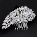 Elegant silver bridal hair comb with pear-shaped rhinestones on a sparkling black background - Silver