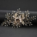Eleganter Brauthaarkamm mit silbernen Blättern und glitzernden Strasssteinen für die Hochzeit - Gold