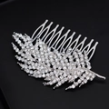 Elegant silver feather hair comb with crystals for bridal wedding hairstyles on black background - Silver
