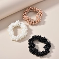 Trois élastiques à cheveux élégants en perles en blanc, champagne et noir - Élastiques à Perles (Emballage Trio)
