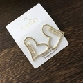 Hollow heart stud earrings with sparkling crystals and gold plating on wood background - Heart Stud