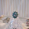 Macro view of oval stainless steel ring with dried flowers and small pearls inlay - Deep Cyan Base Pink Blue Flower Style (B款)