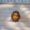 Macro detail of handmade oval bronze ring featuring white dried flowers in amber resin - Adjustable / Bronze Amber Yellow White Style (Type C)